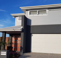 Modern two-story Hampton Style house - Mackay Tourism
