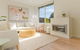 Idyllic 4-Bed Home With Alfresco Area Near Beach - thumb 1